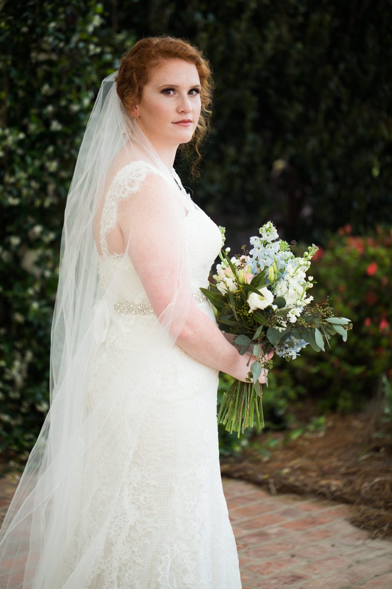 monroe louisiana bride in veil looking over right shoulder 
