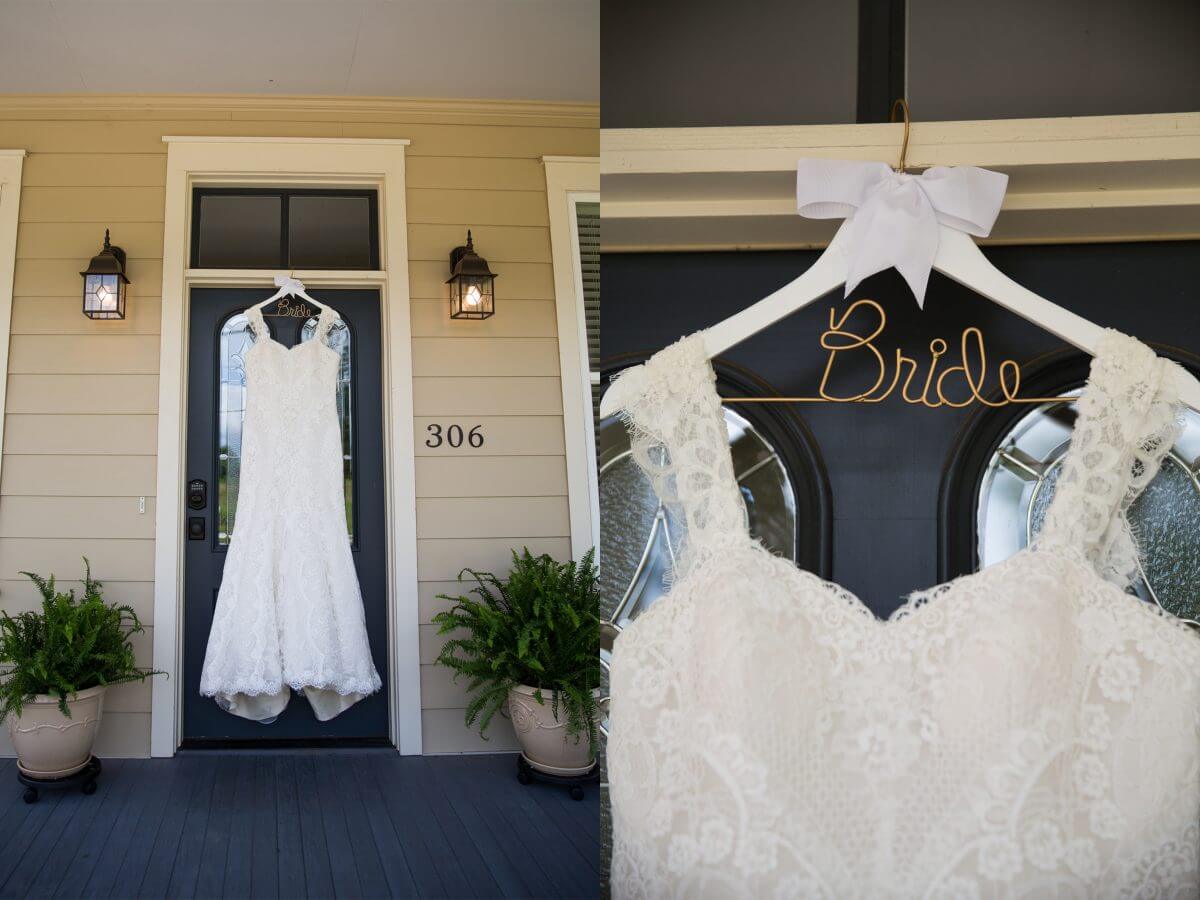 white wedding dress hanging in doorway on a custom bride hanger