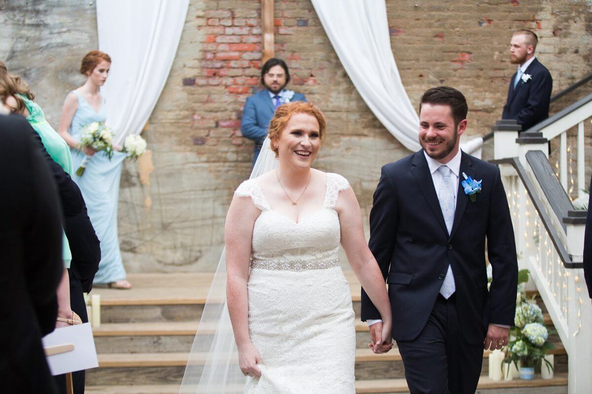 bride and groom exiting wedding ceremony at the Norton Building in Ruston, LA