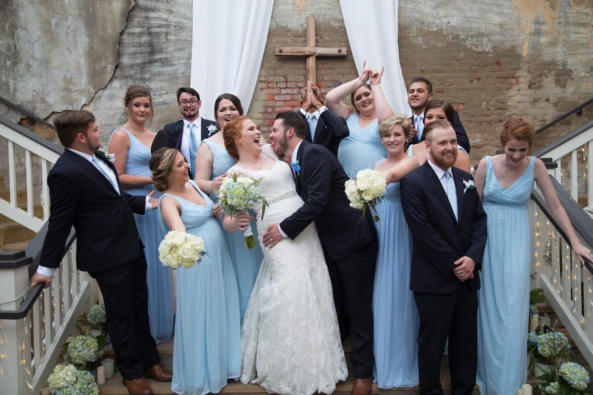bridal party laughing and smiling on dais at the Norton Building in Ruston, LA