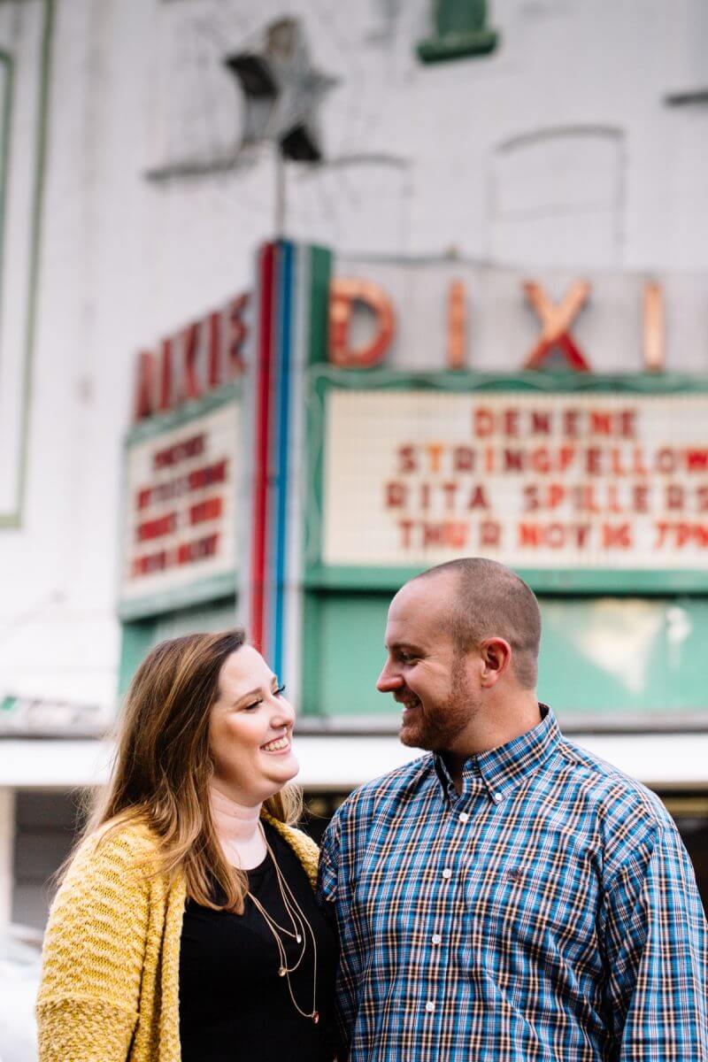 Engaged couple outside of the Dixie Theater in downtown Ruston, Louisiana.